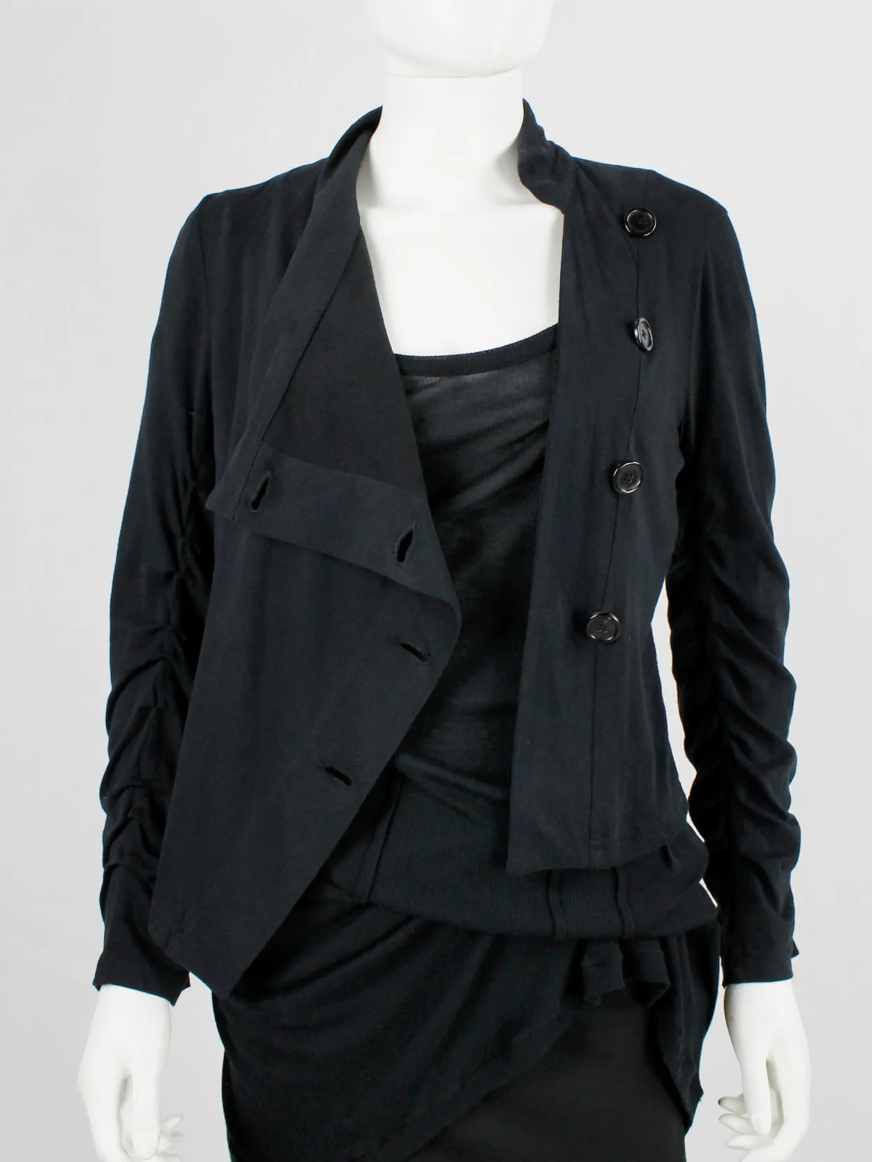 Ann Demeulemeester black asymmetric cardigan with buttons and tucked sleeves