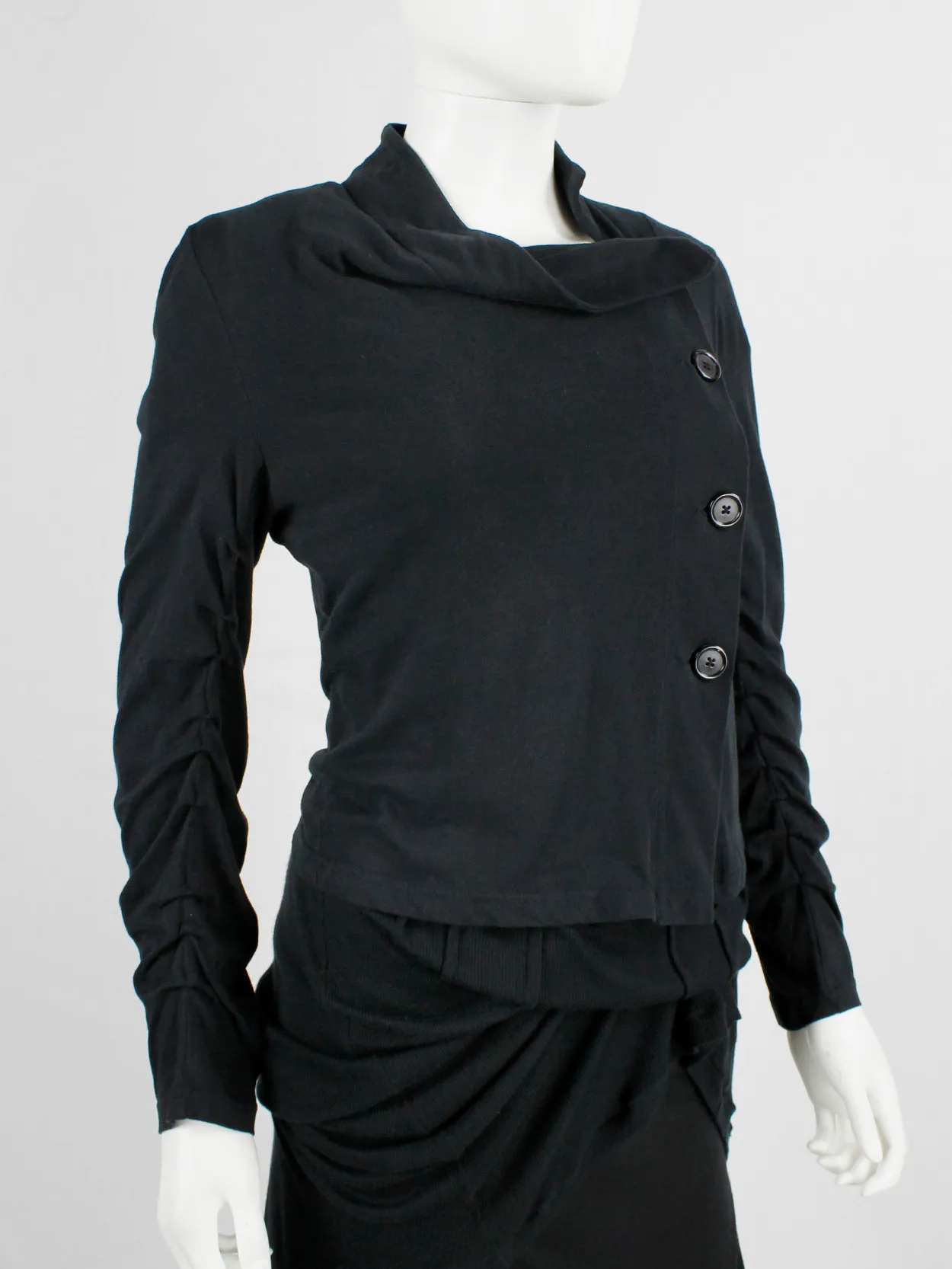 Ann Demeulemeester black asymmetric cardigan with buttons and tucked sleeves