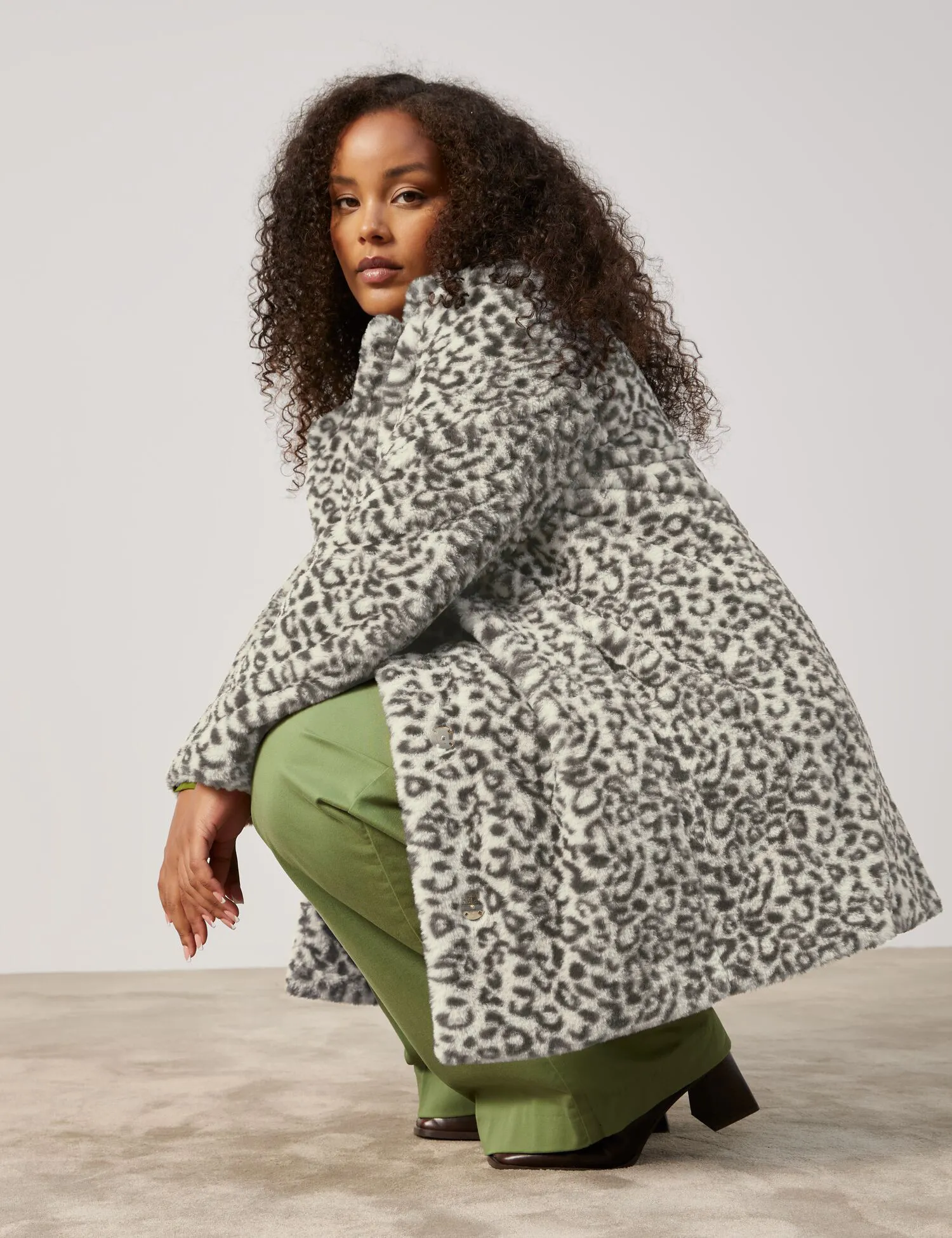 Faux fur coat with a leopard print pattern