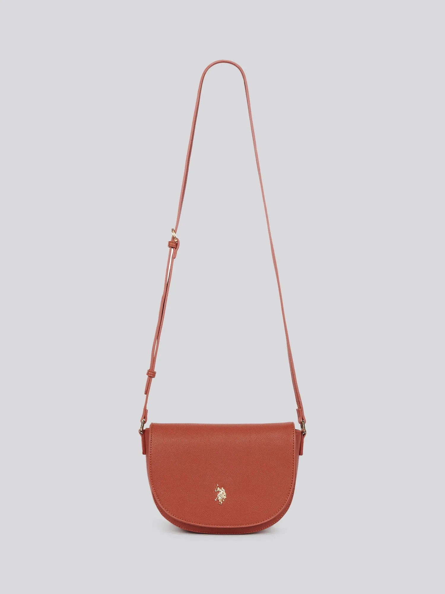 U.S. Polo Assn. Womens Jones Flap Crossbody Bag in Rust